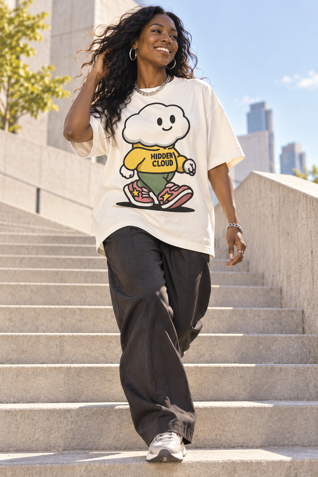AI campaign concept: a smiling adult model in an oversized Kumo graphic tee moving through sunlit city architecture